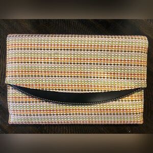 New Day clutch with hidden wristlet option